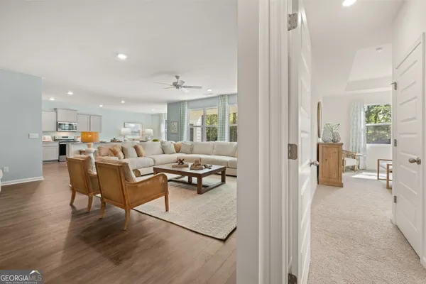 a view of a dining room with furniture window and wooden floor