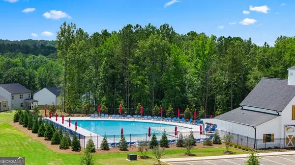 swimming pool view with a outdoor seating