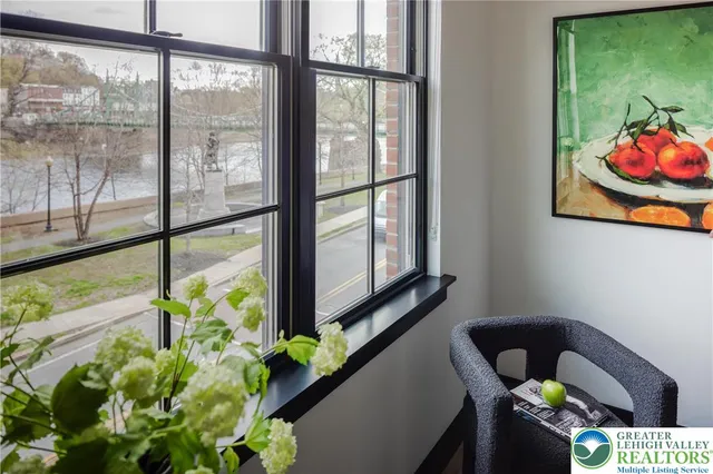 a view of a room with furniture and a potted plant