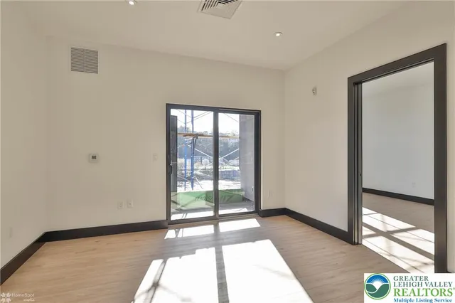 a view of an empty room and window