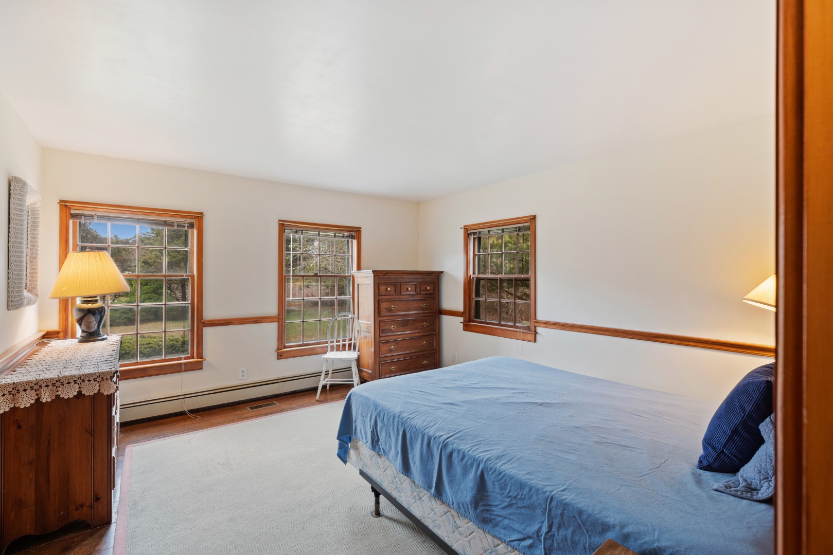 137 Surfside Road Nantucket, MA 02554 - Photo 10 of 24 a bedroom with a large bed and a window