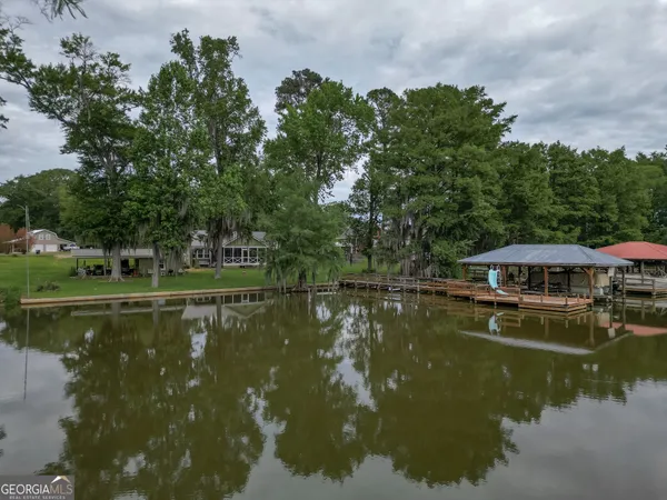 a view of a lake with a house in the background