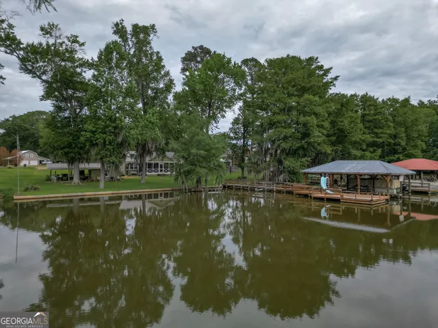 a view of a lake with a house in the background