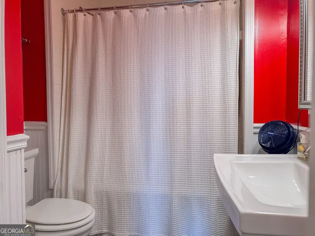 a bathroom with a toilet and a sink