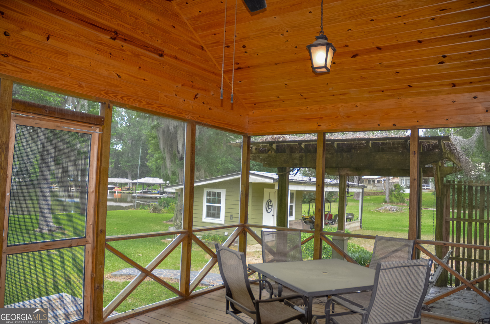 110 Tom Holman Road Cobb, GA 31735 - Photo 14 of 18 a view of a patio with a backyard