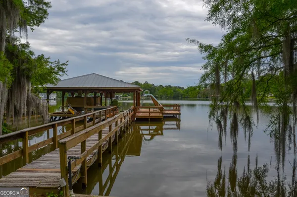 a view of house with outdoor seating and city view
