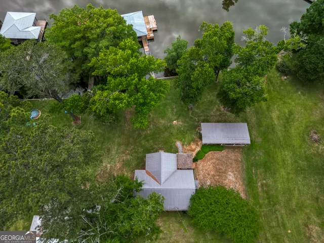 an aerial view of a house with outdoor space