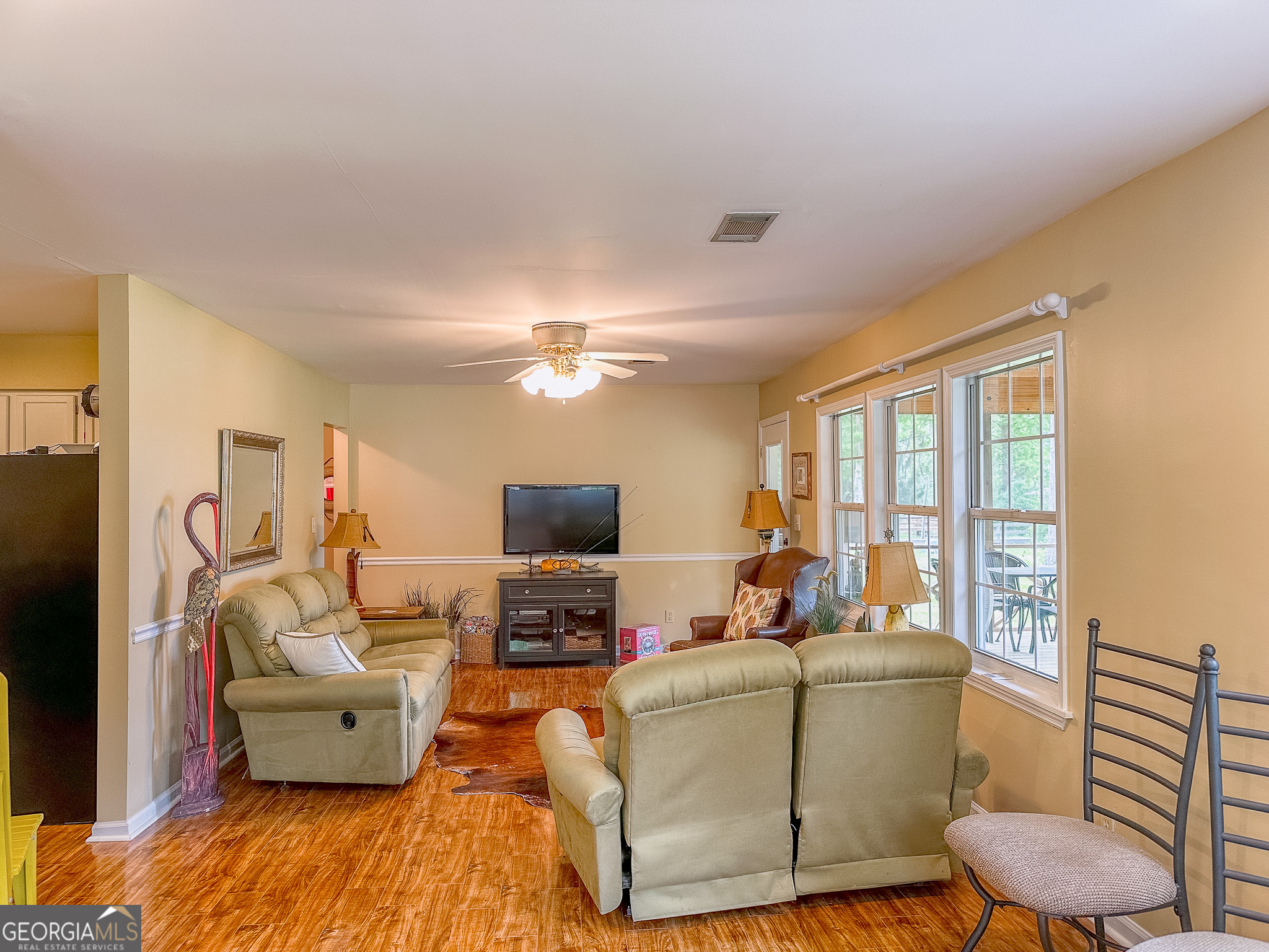 110 Tom Holman Road Cobb, GA 31735 - Photo 4 of 18 a living room with furniture and a flat screen tv