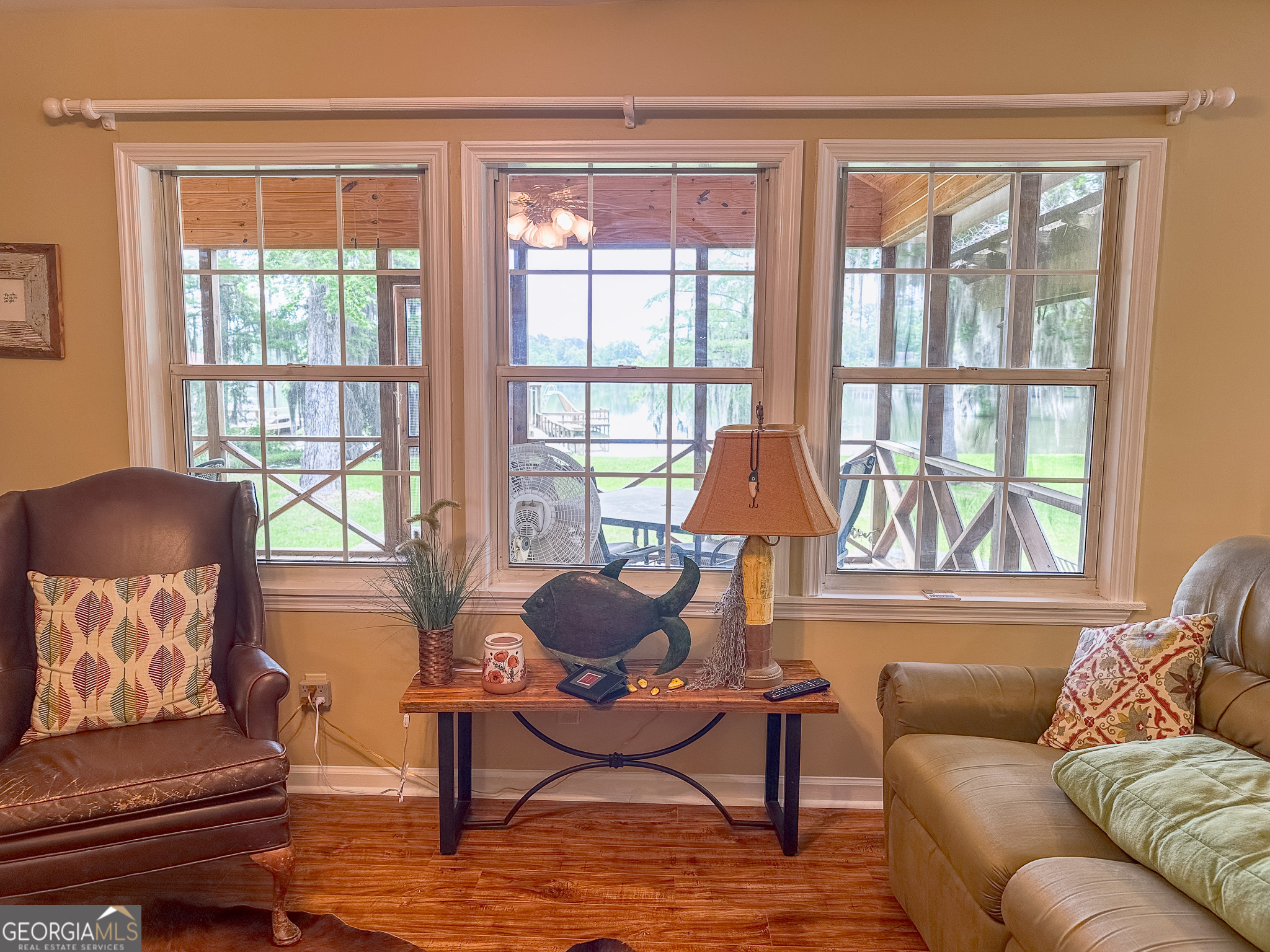 110 Tom Holman Road Cobb, GA 31735 - Photo 5 of 18 a living room with furniture and a large window