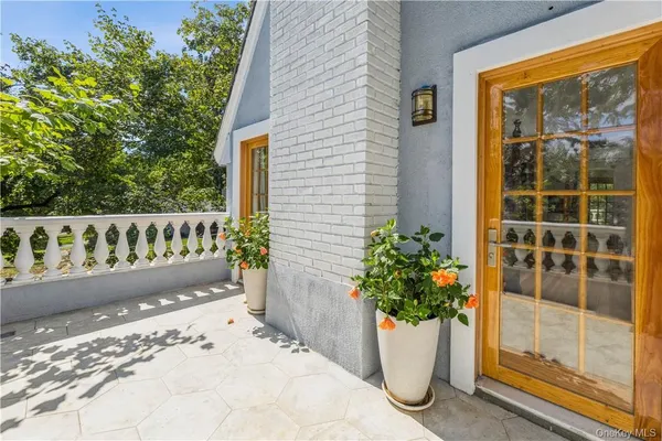 a view of a house with a potted plant
