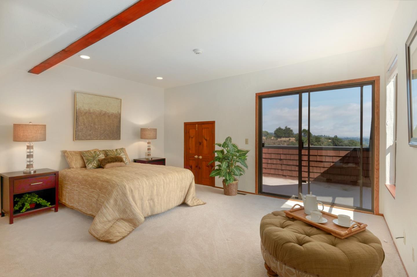 185 La Cima Street Soquel, CA 95073 - Photo 22 of 39 a bedroom with a bed and glass windows