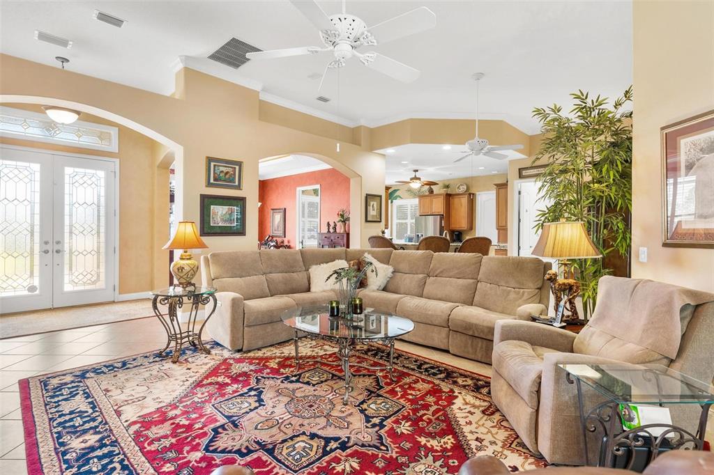 5903 Spinnaker Loop Lady Lake, FL 32159 - Photo 16 of 73 a living room with furniture and a chandelier