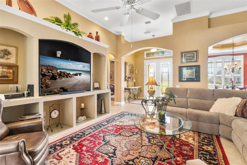 5903 Spinnaker Loop Lady Lake, FL 32159 - Photo 17 of 73 a living room with furniture and a chandelier