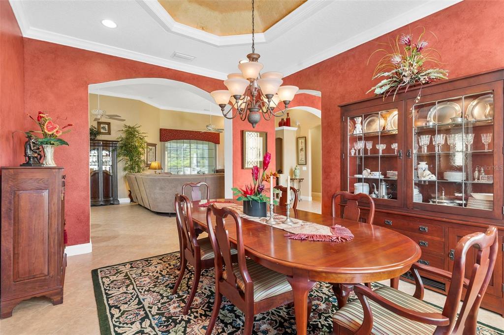 5903 Spinnaker Loop Lady Lake, FL 32159 - Photo 21 of 73 a view of a dining room with furniture wooden floor and chandelier
