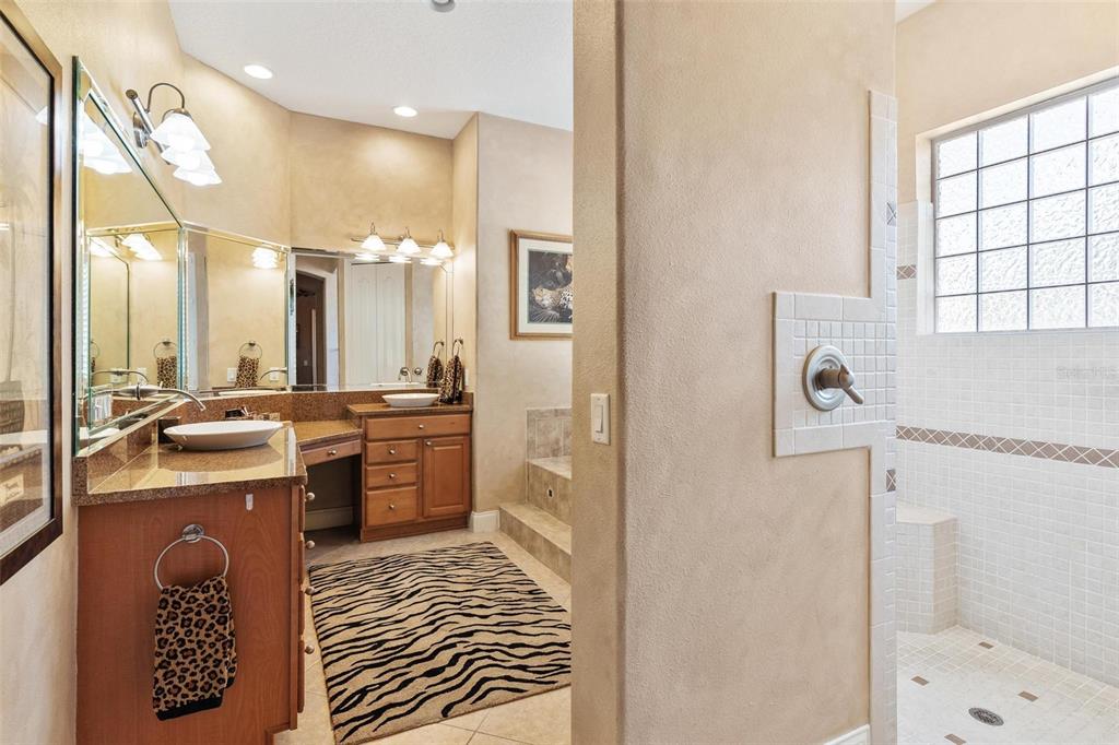 5903 Spinnaker Loop Lady Lake, FL 32159 - Photo 34 of 73 a bathroom with a sink a toilet and shower