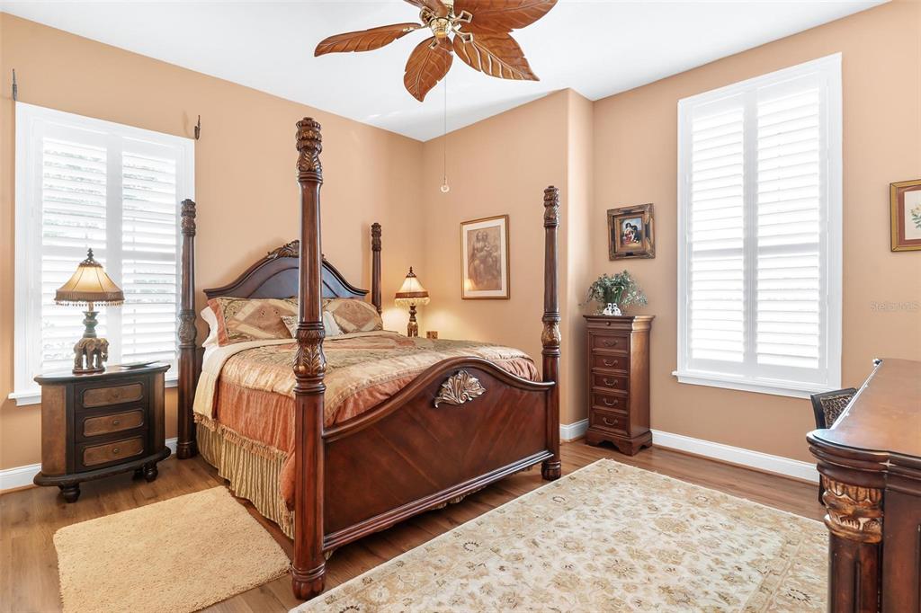 5903 Spinnaker Loop Lady Lake, FL 32159 - Photo 40 of 73 a bedroom with a bed next to a window with a flat screen tv