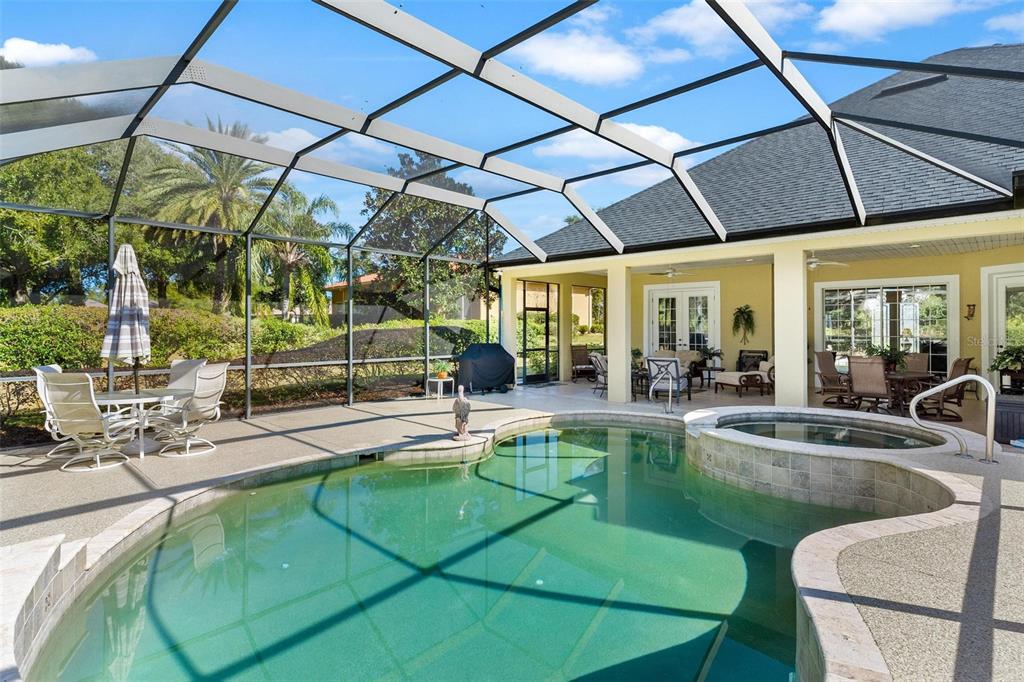 5903 Spinnaker Loop Lady Lake, FL 32159 - Photo 4 of 73 a view of a swimming pool with a patio