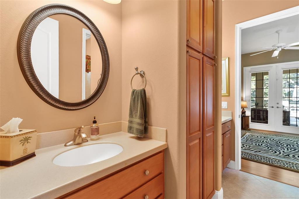 5903 Spinnaker Loop Lady Lake, FL 32159 - Photo 44 of 73 a bathroom with a sink and a mirror