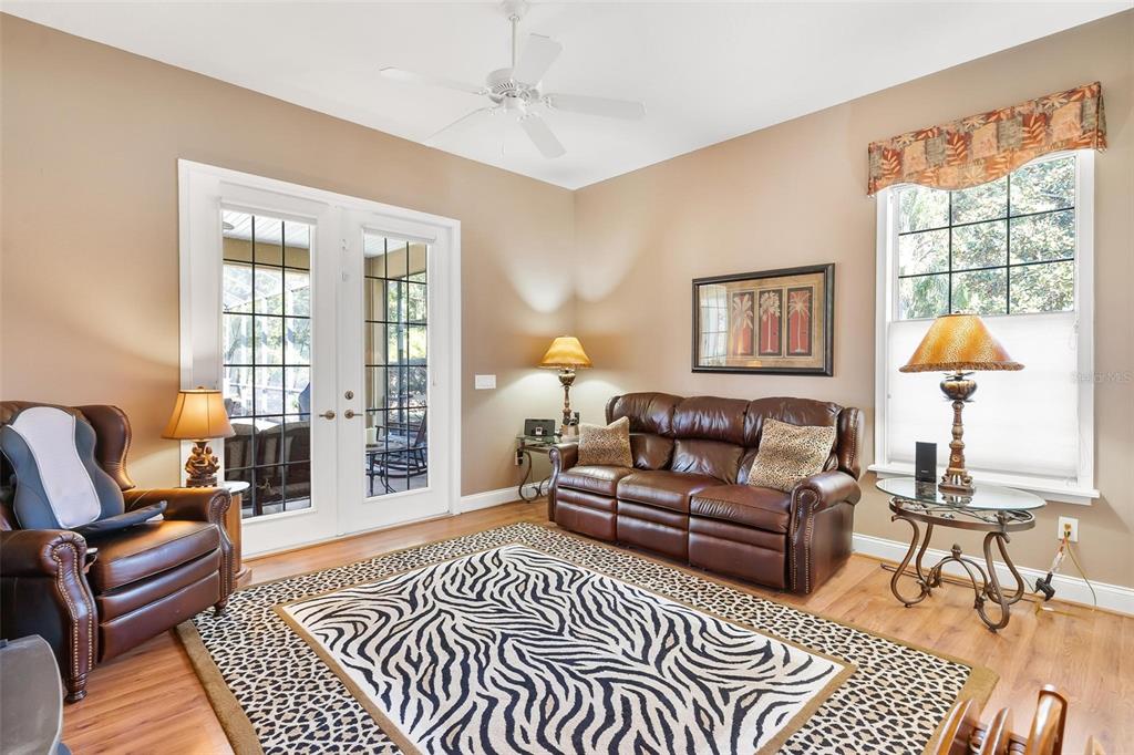 5903 Spinnaker Loop Lady Lake, FL 32159 - Photo 46 of 73 a living room with furniture a lamp and a table
