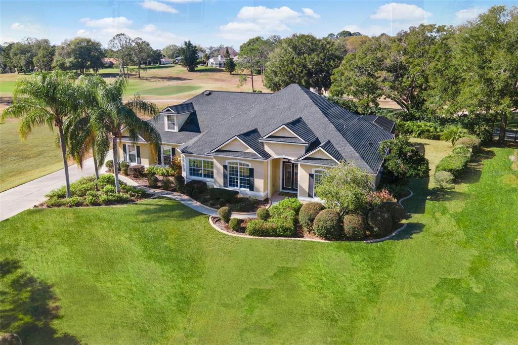 5903 Spinnaker Loop Lady Lake, FL 32159 - Photo 61 of 73 a aerial view of a house with swimming pool garden and lake view