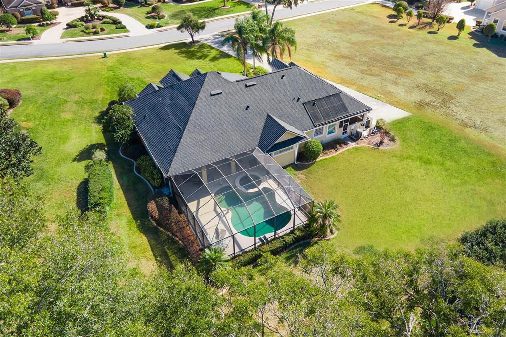 5903 Spinnaker Loop Lady Lake, FL 32159 - Photo 63 of 73 an aerial view of a house with a garden and swimming pool