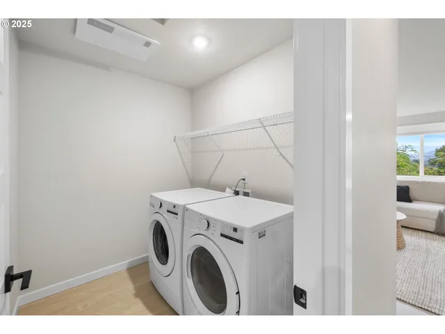 a utility room with dryer and washer