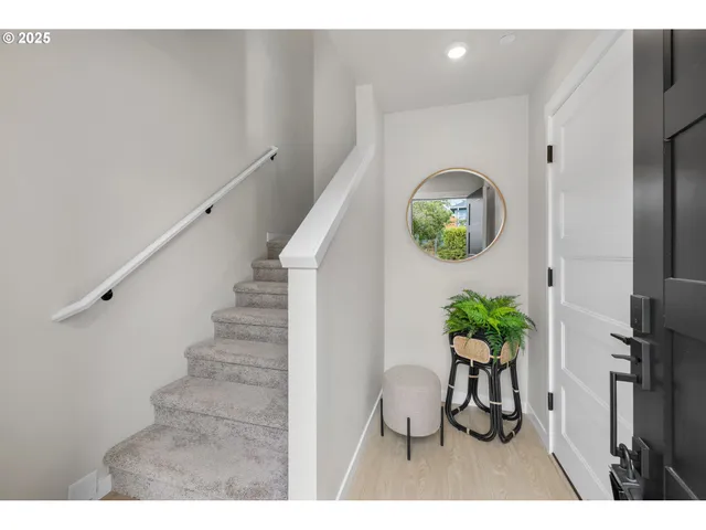 a view of entryway with wooden floor