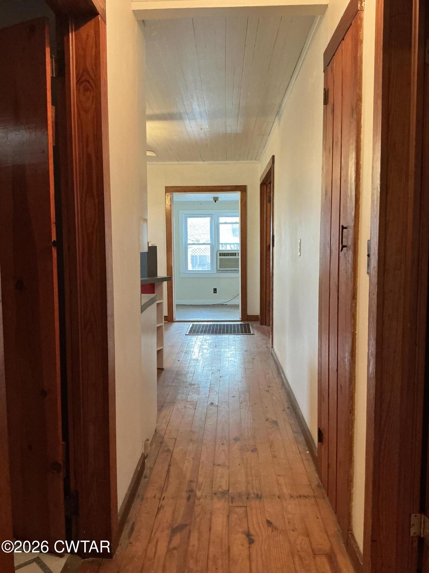 84 Carter Street Alamo, TN 38001 - Photo 11 of 25 a view of a hallway with wooden floor and staircase