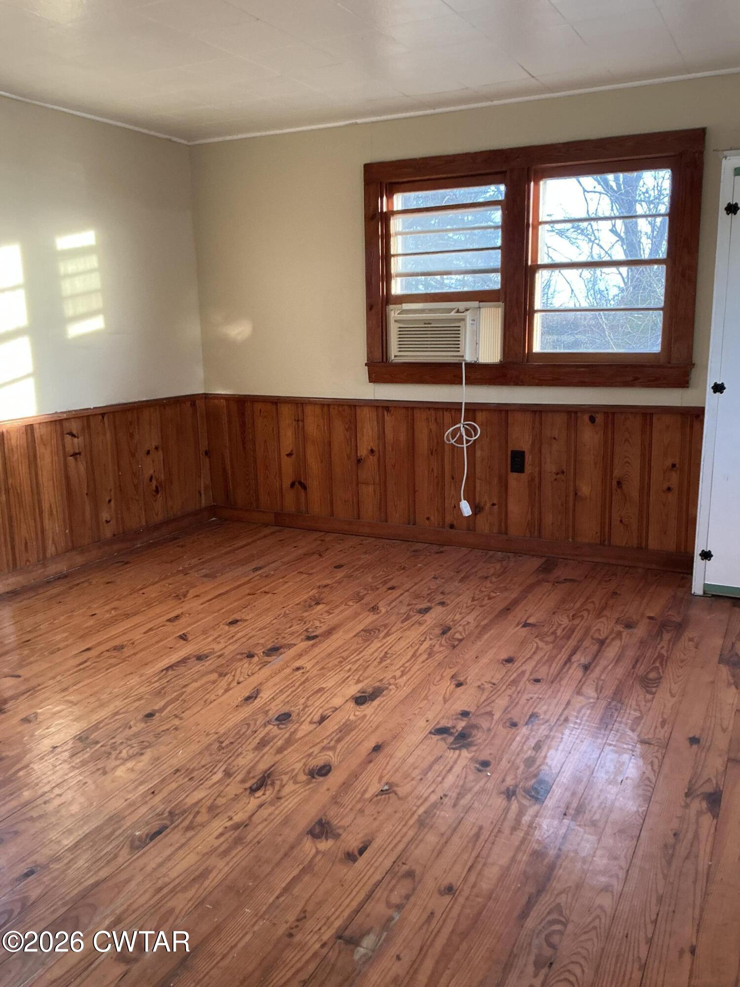 84 Carter Street Alamo, TN 38001 - Photo 17 of 25 a view of wooden floor and windows in a room