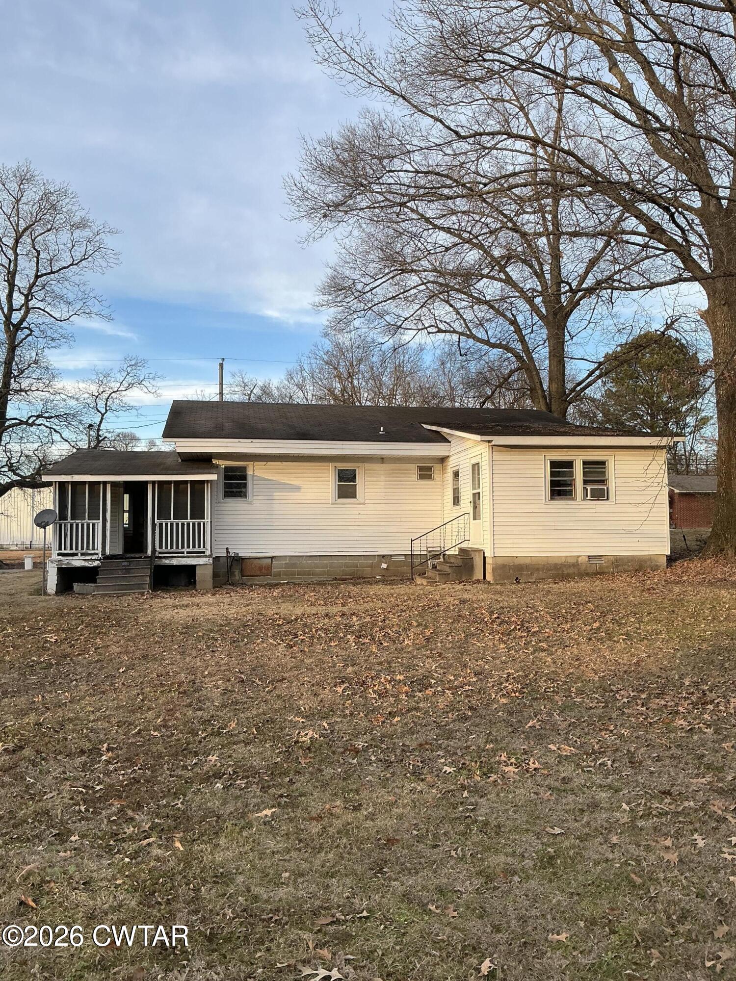 84 Carter Street Alamo, TN 38001 - Photo 2 of 25 front view of a house with a yard