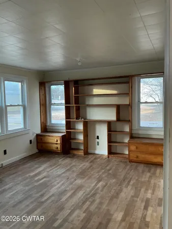 a room with stairs and a window