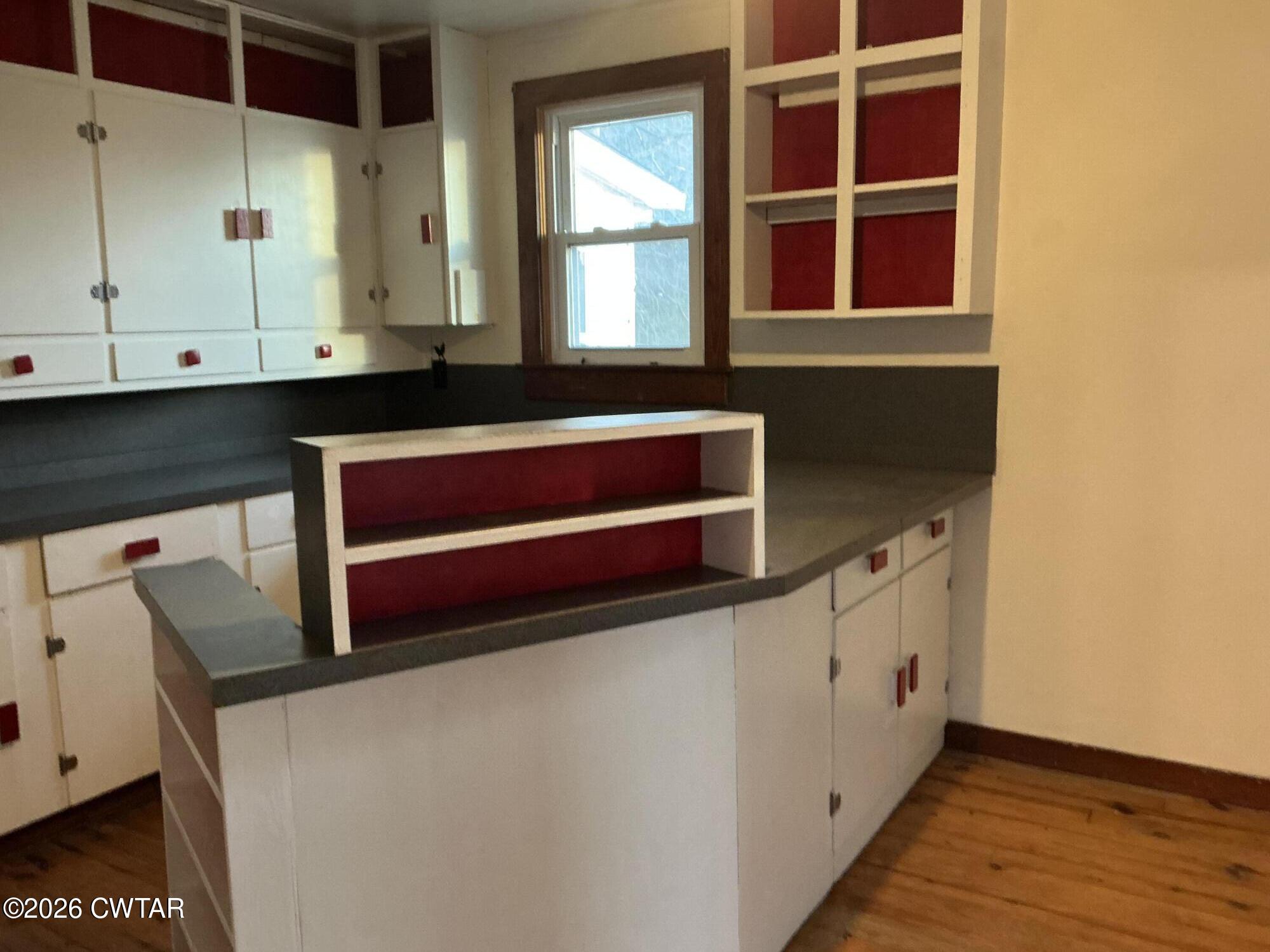 84 Carter Street Alamo, TN 38001 - Photo 5 of 25 a room with rack on wall and a window