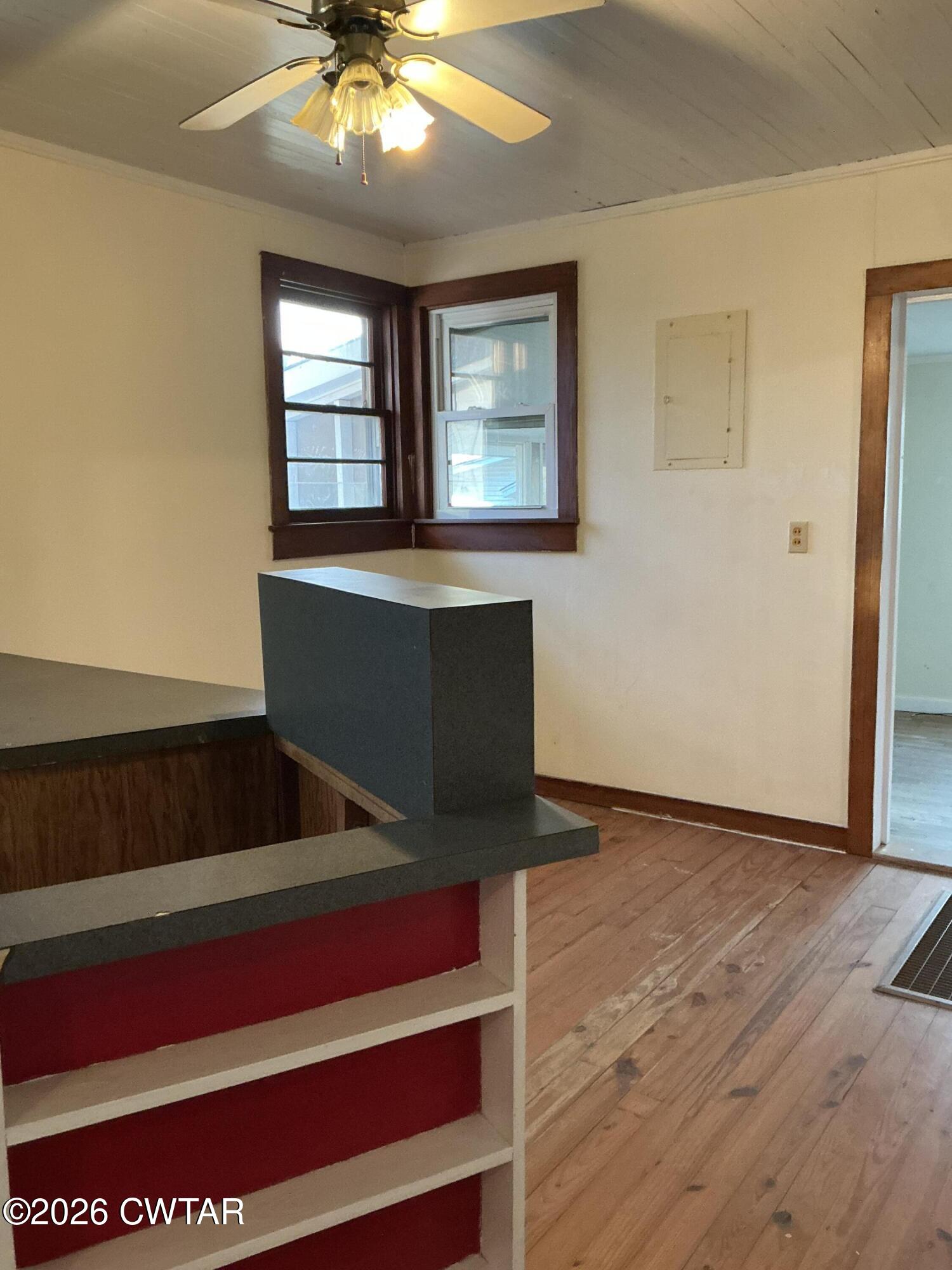 84 Carter Street Alamo, TN 38001 - Photo 8 of 25 a view of an empty room with wooden floor and a window