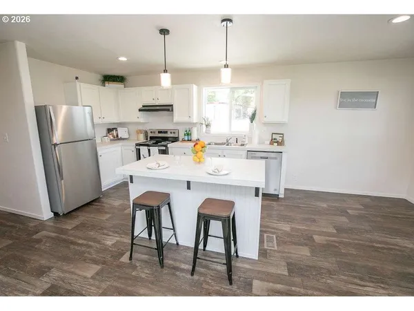 a view of a kitchen and dining room