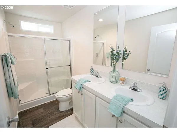 a bathroom with a sink toilet and shower