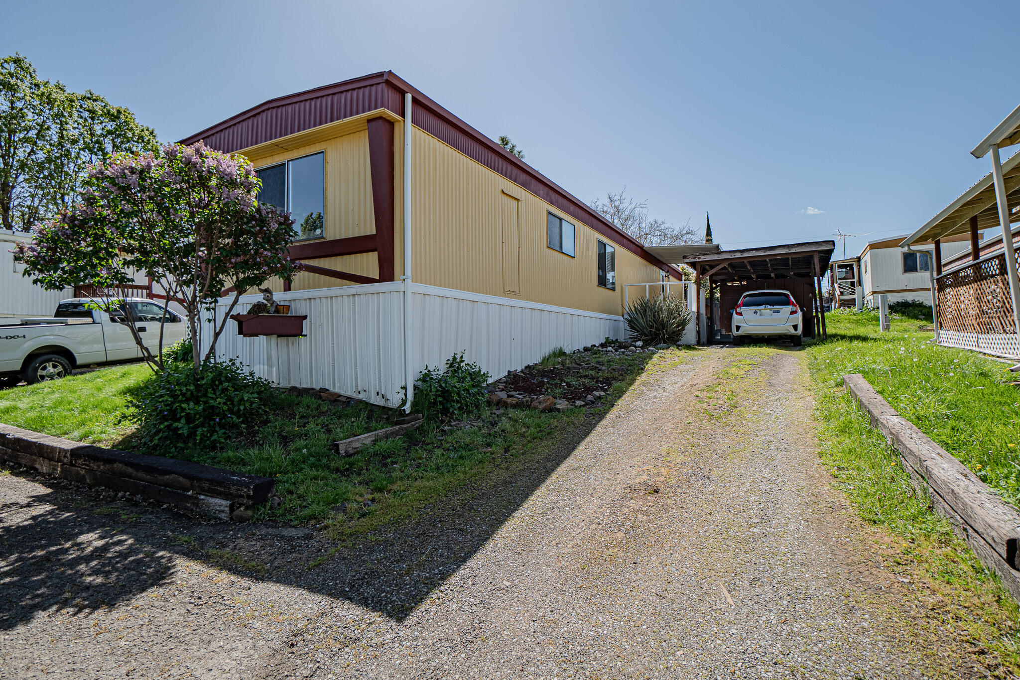 421 Stevens Road, Unit 26 Eagle Point, OR 97524 - Photo 2 of 23 a front view of a house with garden