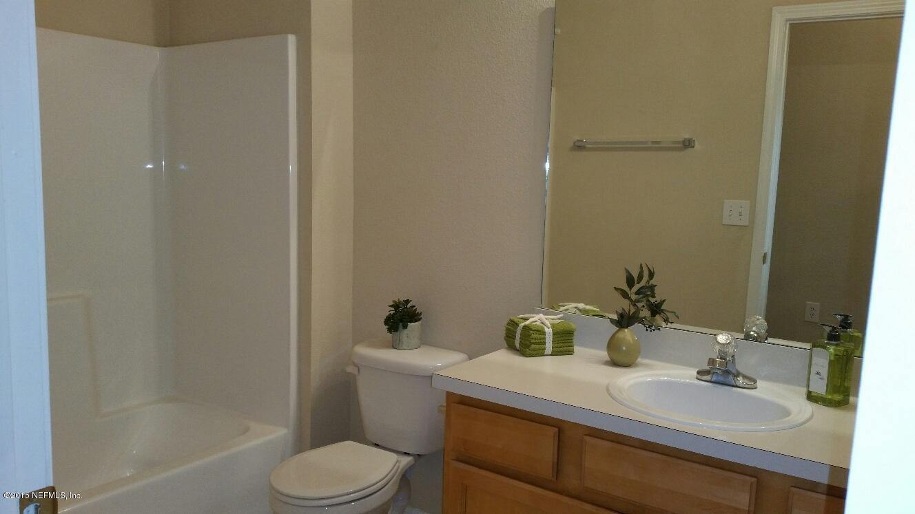 7920 Merrill Road, Unit 1804 Jacksonville, FL 32277 - Photo 15 of 35 a bathroom with a sink toilet and shower