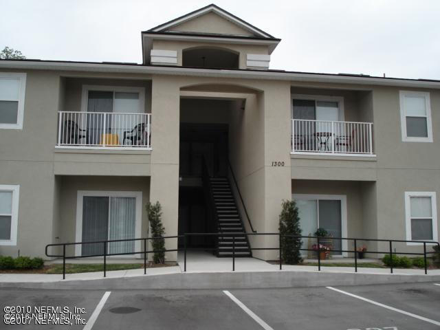 7920 Merrill Road, Unit 1804 Jacksonville, FL 32277 - Photo 2 of 35 a front view of a house with a garage