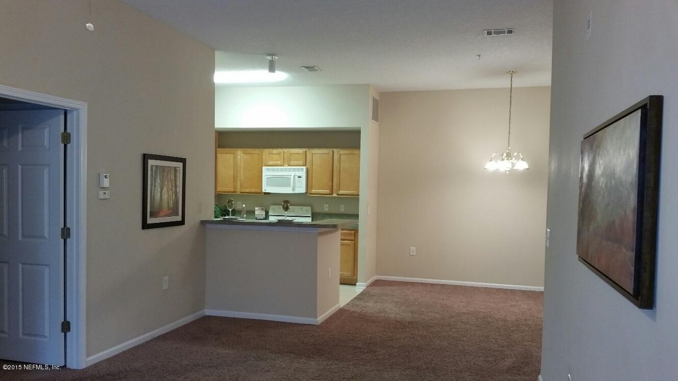 7920 Merrill Road, Unit 1804 Jacksonville, FL 32277 - Photo 10 of 35 a view of a kitchen with a sink