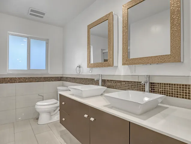 a bathroom with a sink and a toilet