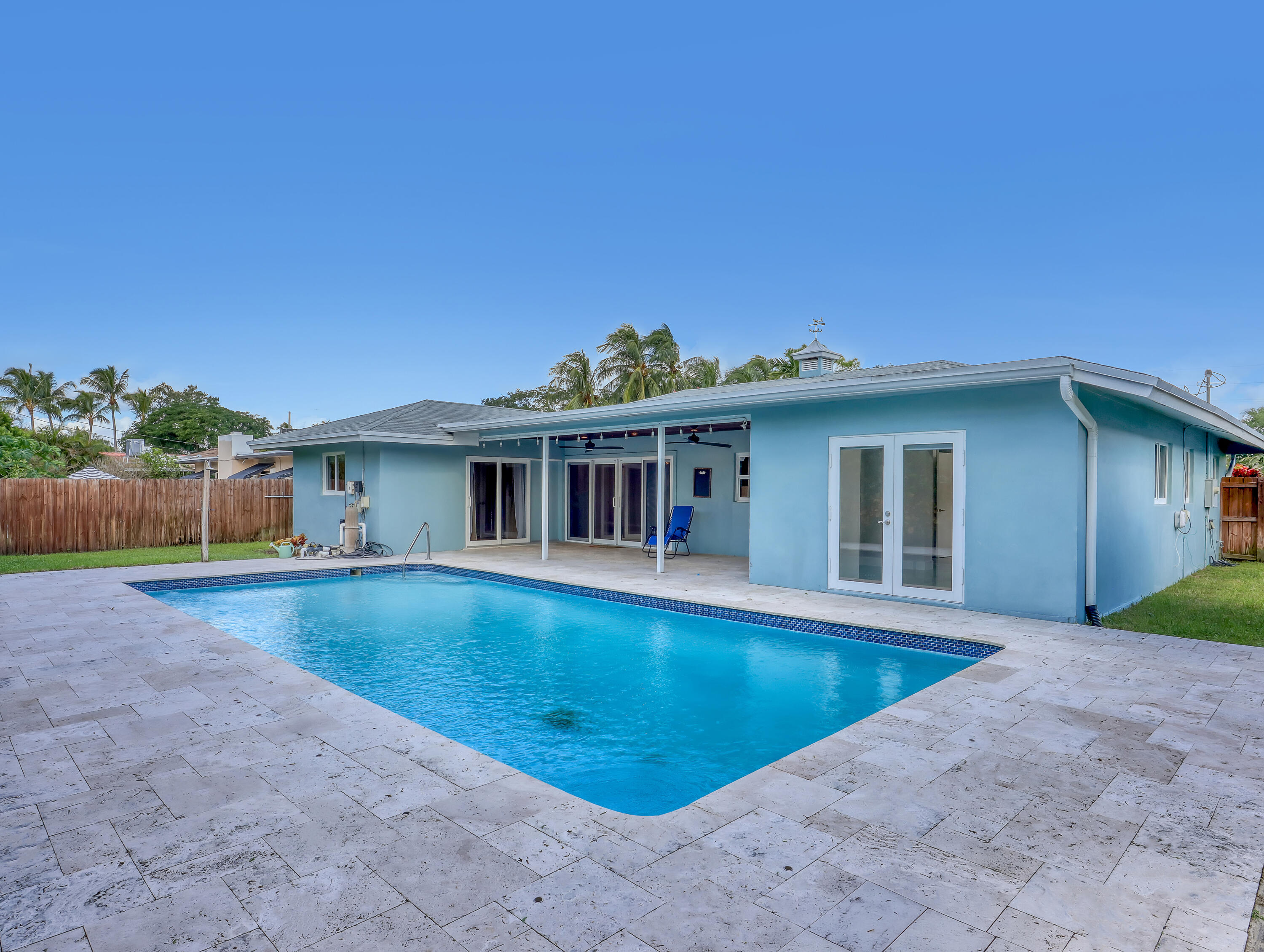 1298 Northwest 4th Street Boca Raton, FL 33486 - Photo 33 of 36 a view of a house with swimming pool and a yard