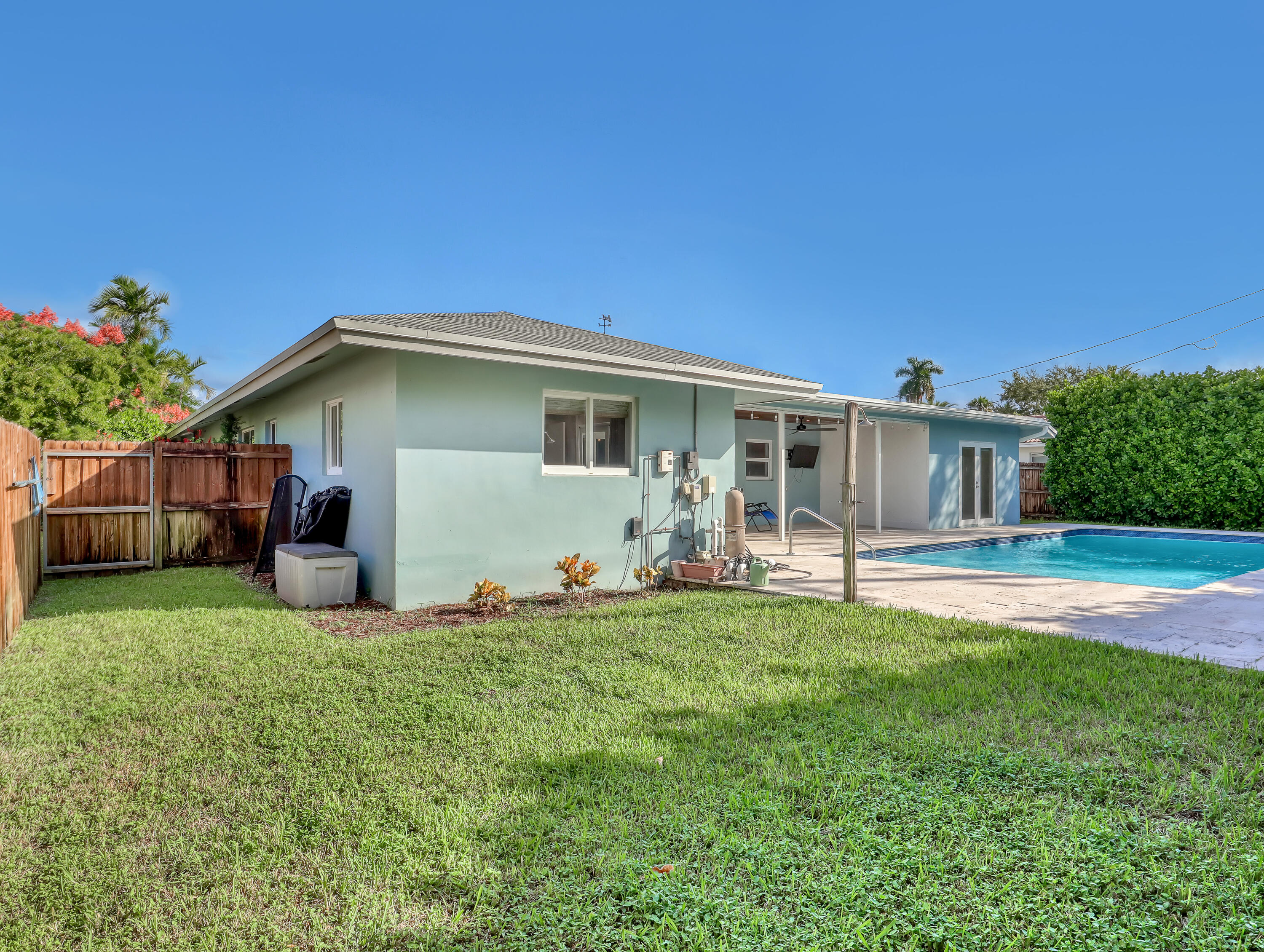 1298 Northwest 4th Street Boca Raton, FL 33486 - Photo 35 of 36 a big house with a big yard and large trees