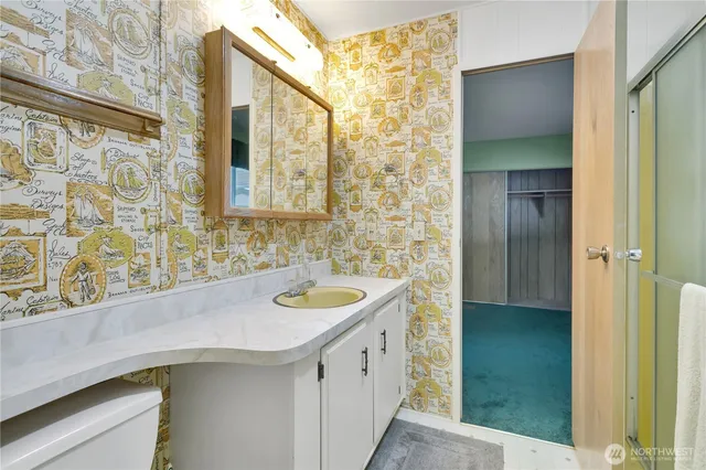 a bathroom with a sink and a mirror