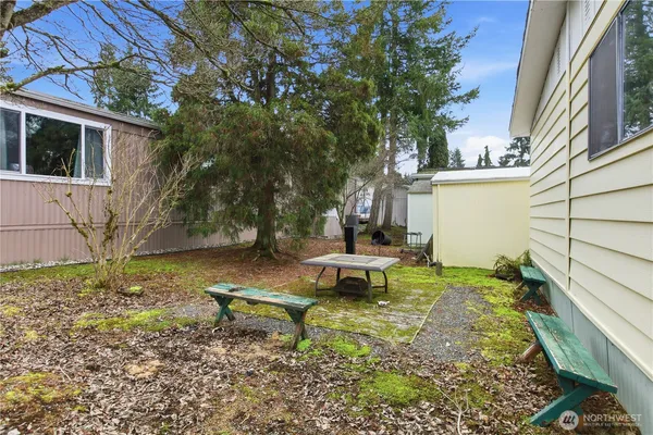 a backyard of a house with outdoor seating