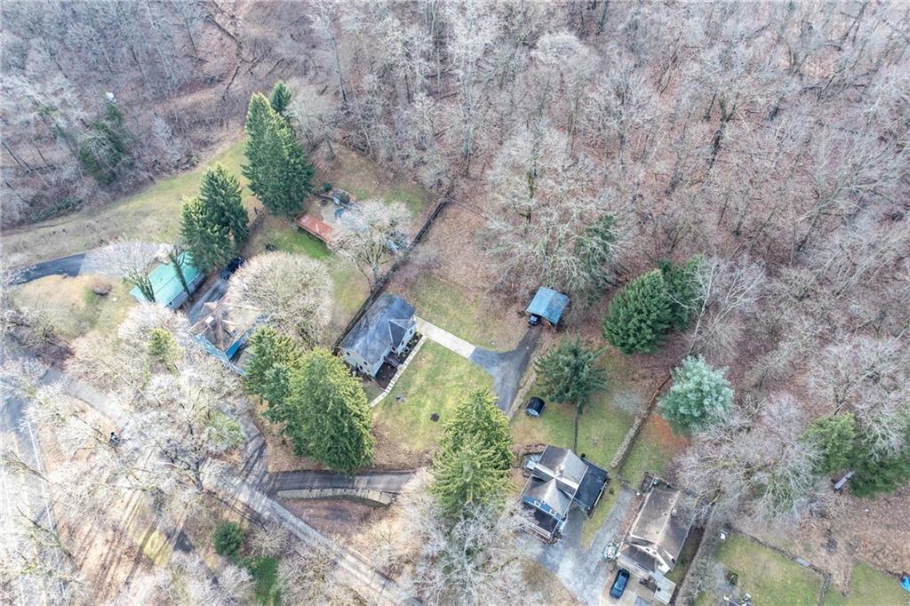 2 Quarry Road Sewickley, PA 15143 - Photo 8 of 29 an aerial view of a house with a yard and a pond