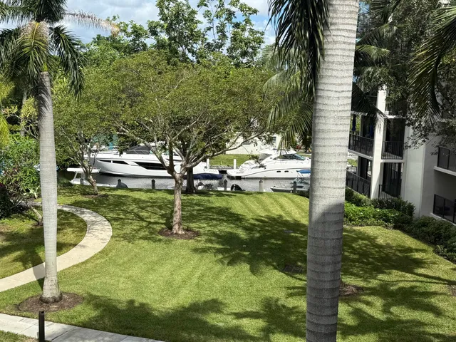 a living room with furniture a wooden floor and next to a window