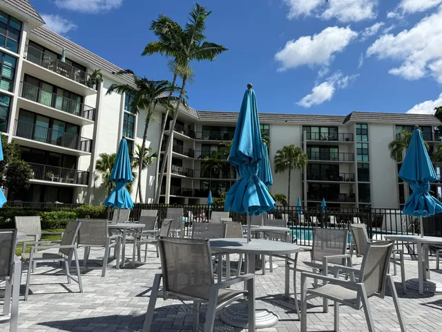 a view of a chairs and table in patio