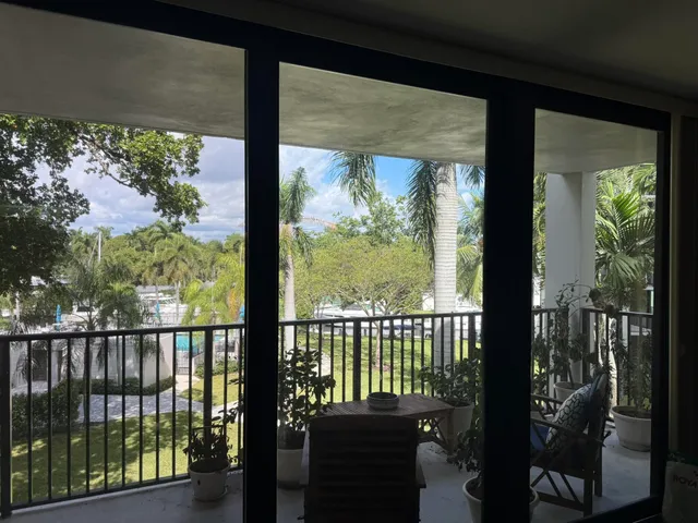 a view of a balcony with chairs