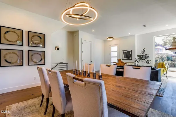 a large kitchen with a table and chairs