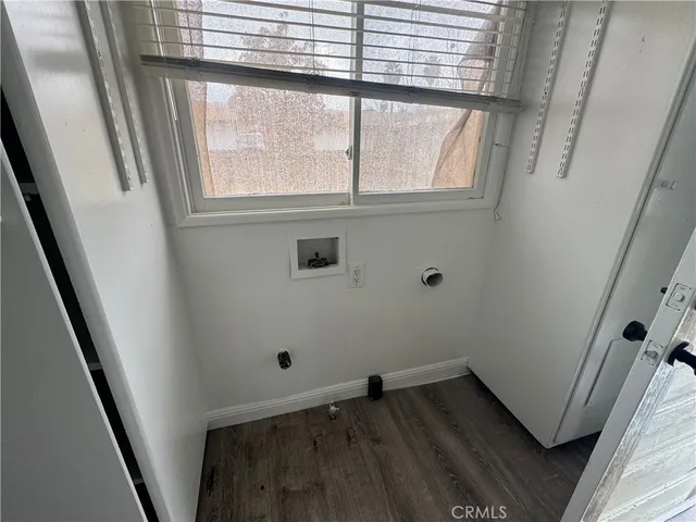 a view of wooden floor and window